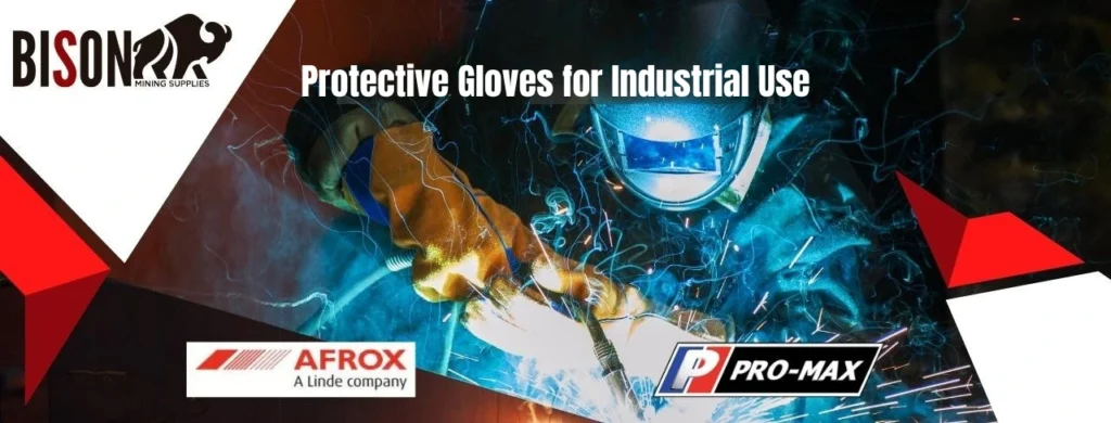 A person wearing protective welding gloves and PPE.